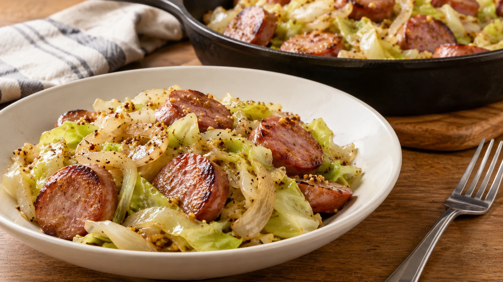 Kielbasa and cabbage skillet served in a shallow bowl