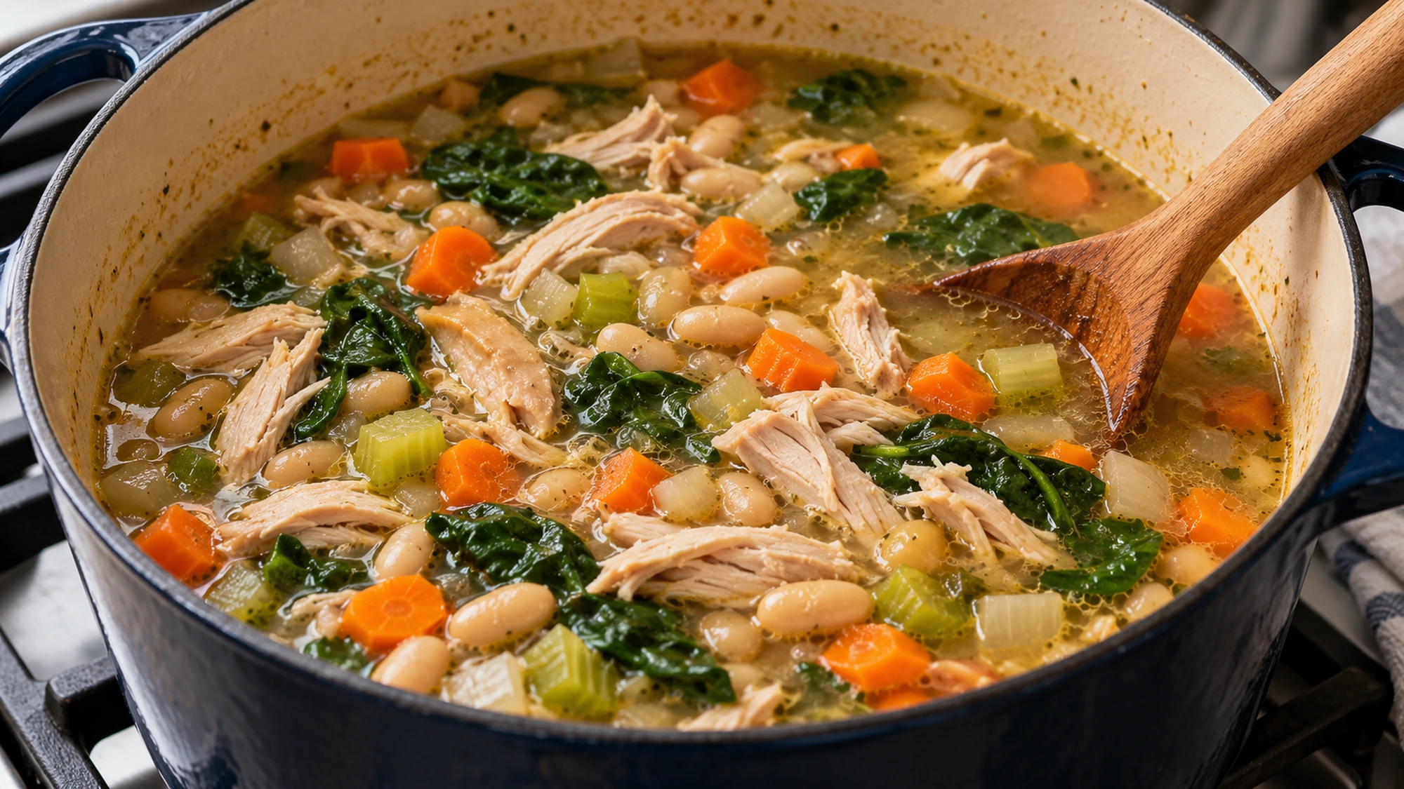Turkey and white bean soup simmering in a Dutch oven